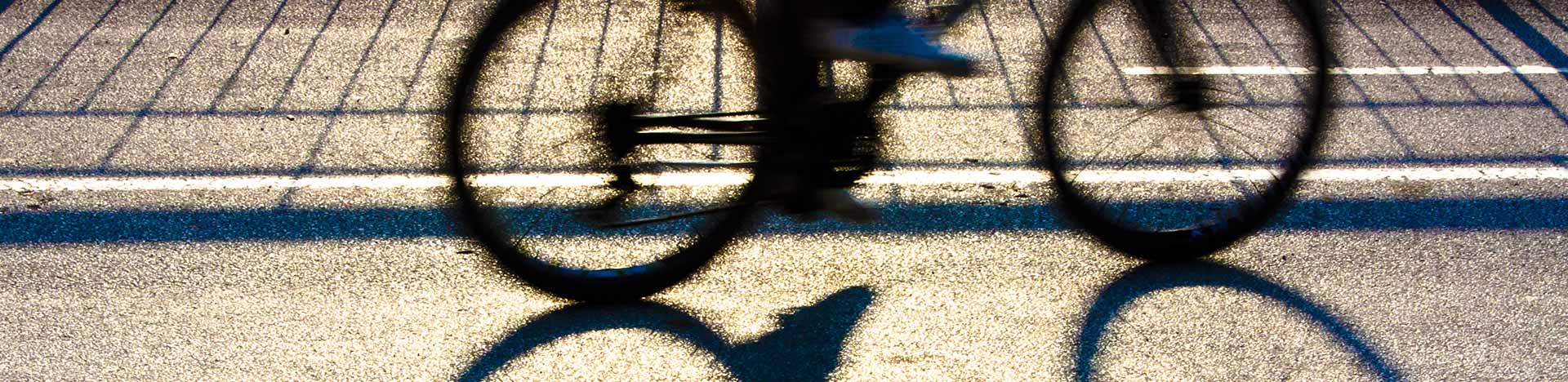 silhouette of a bicycle and it's shadow