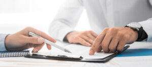 attorney and client looking over fee agreement